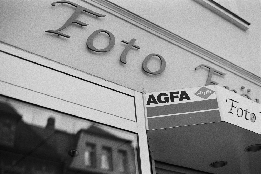 Old Afga sign on a photography shop. Shot on Agfa APX 100