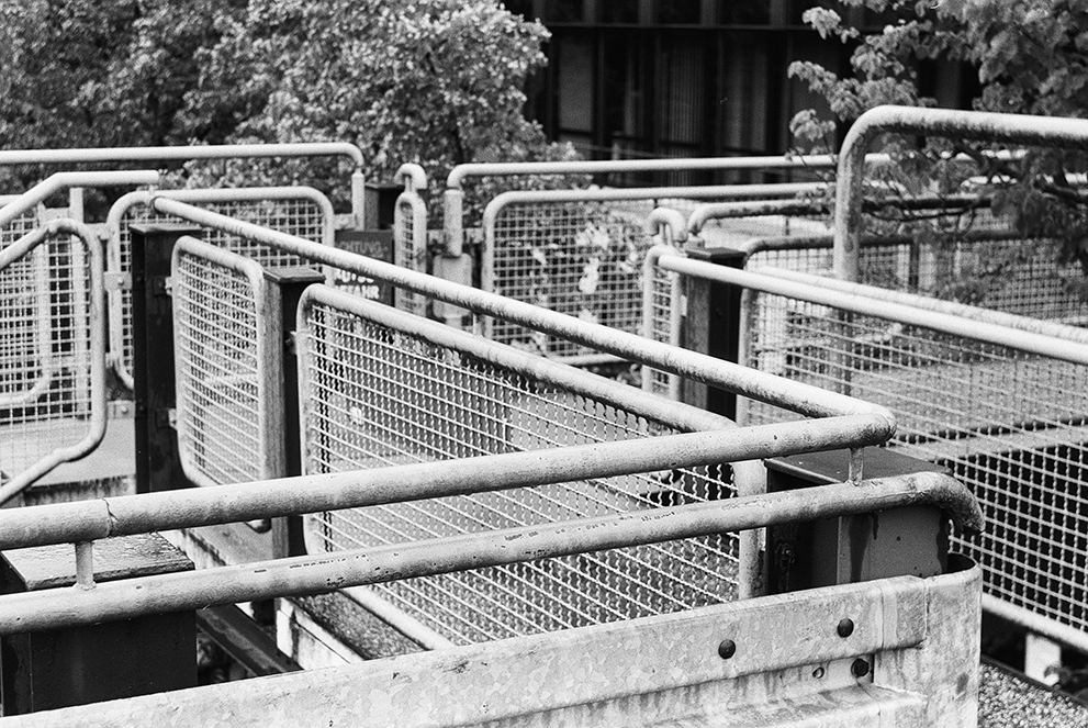 Old-fashioned hand rails on a bridge. Shot on Fomapan 100 classic.