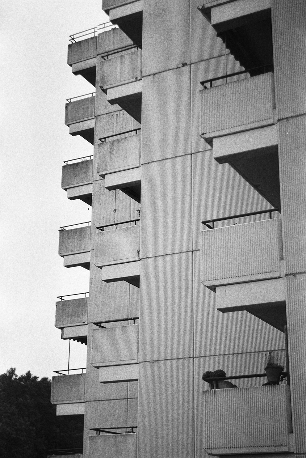 The monotony of balconies on an 80s apartment block. Shot on Fomapan 100 classic.