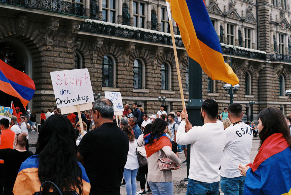 Armenian people demonstrating against drone warfare in their country in front of the Hamburg city hall. Shot on Fujifilm Fujicolor C200.