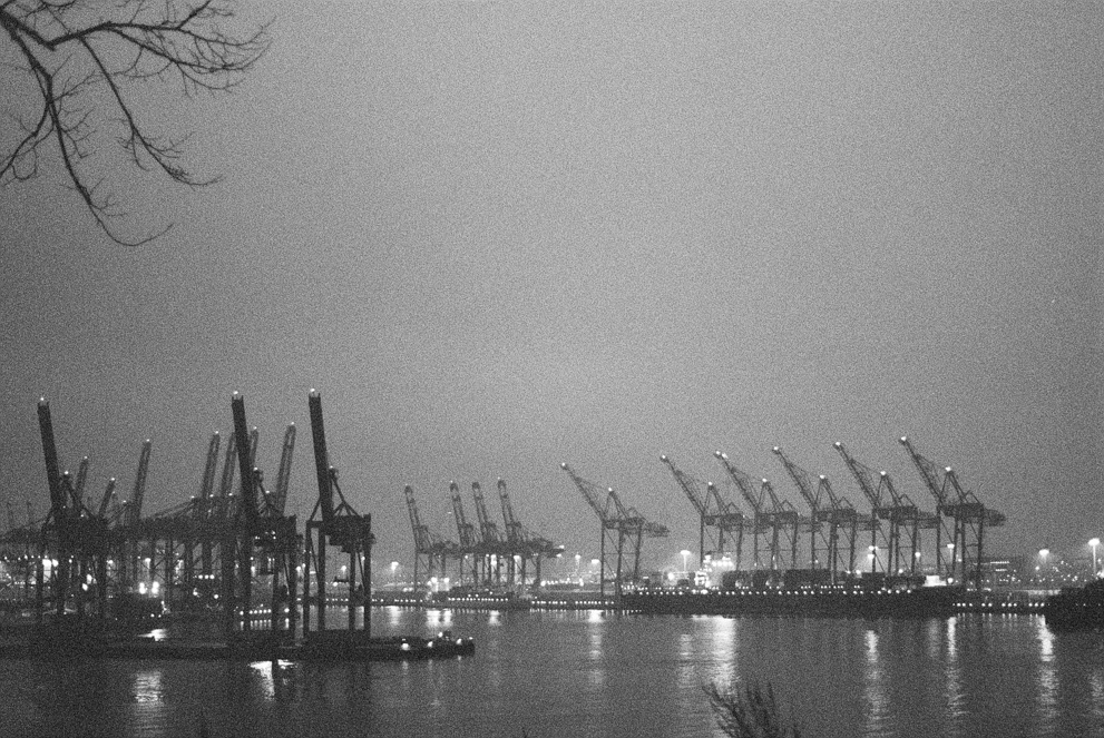 The Hamburg Harbor at night with light fog. Shot on Ilford Delta 3200